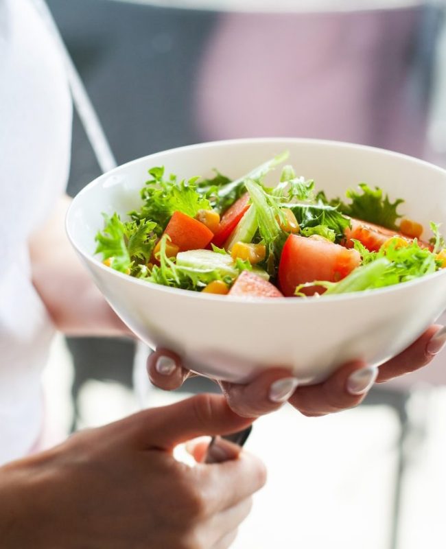 a-woman-on-a-healthy-diet-is-holding-a-diet-salad.jpg